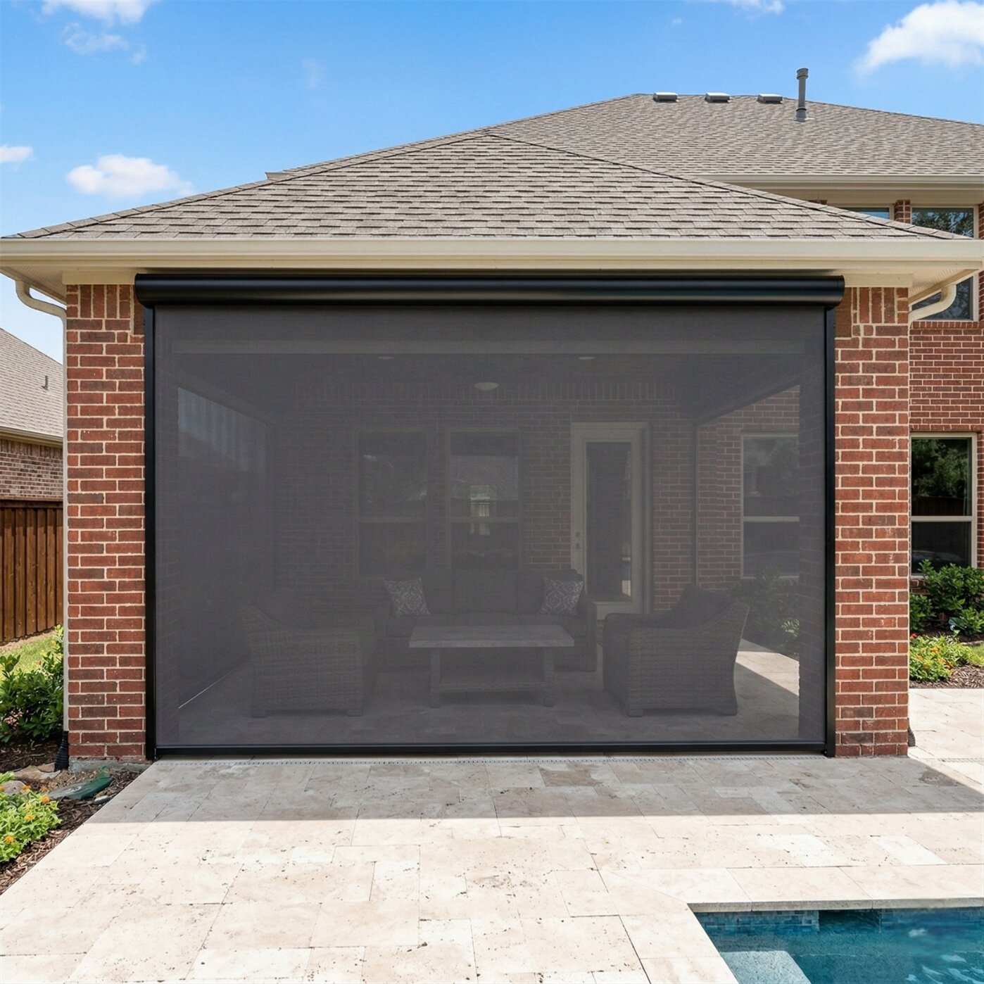 Motorized SunPro patio shades over a residential pool deck in Benbrook, Texas, with shades partially deployed to block afternoon sun and pool glare