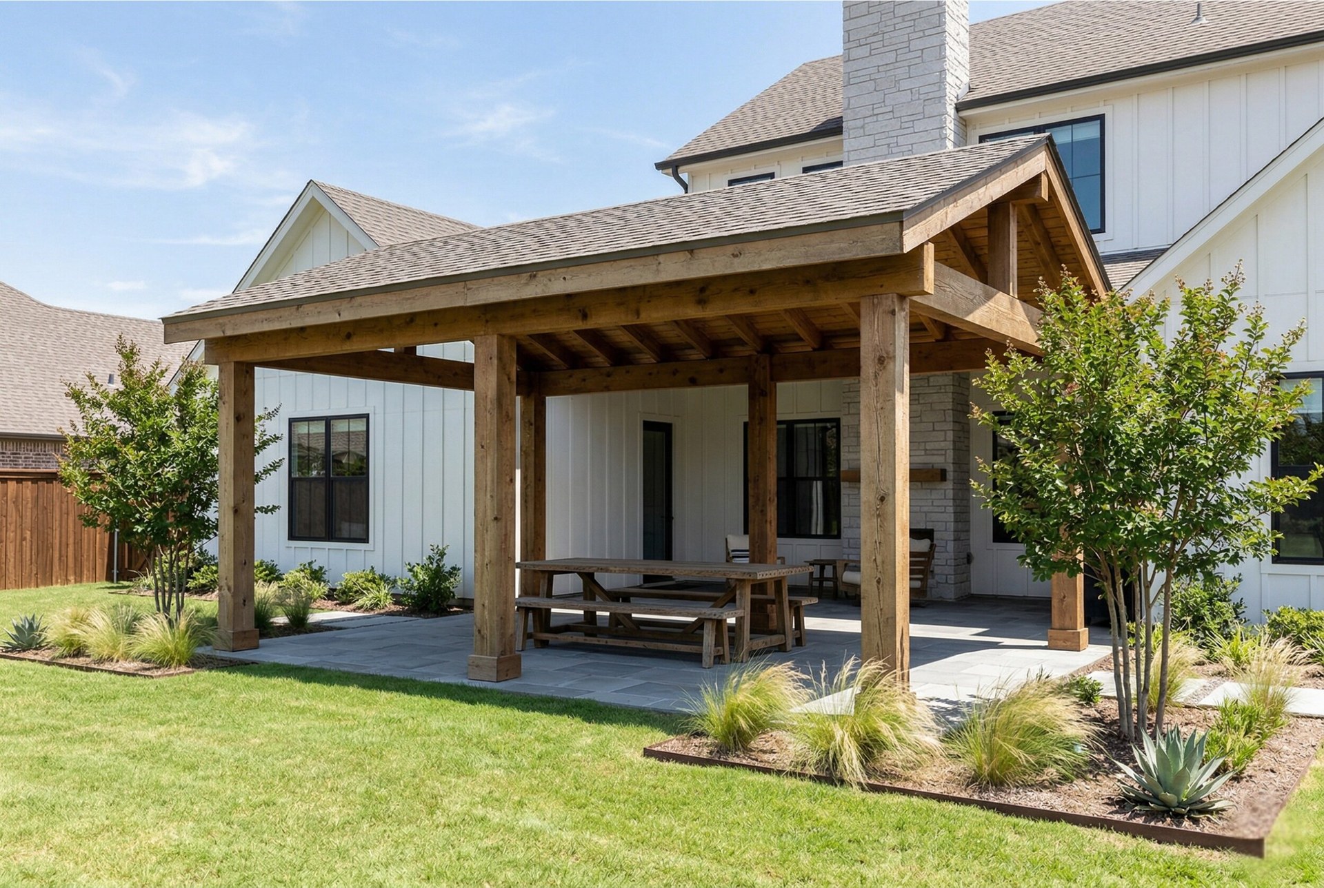 Covered patio on modern farmhouse in Argyle Texas