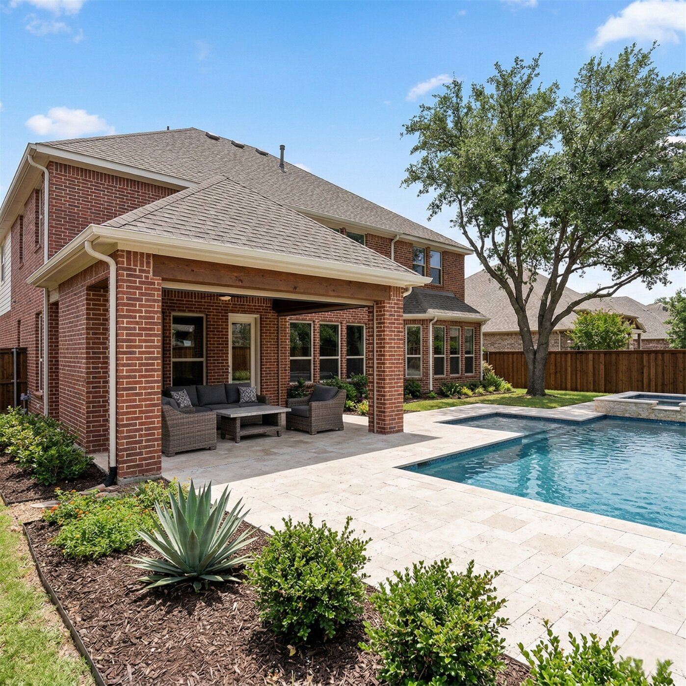 Poolside patio on brick home in Benbrook Texas