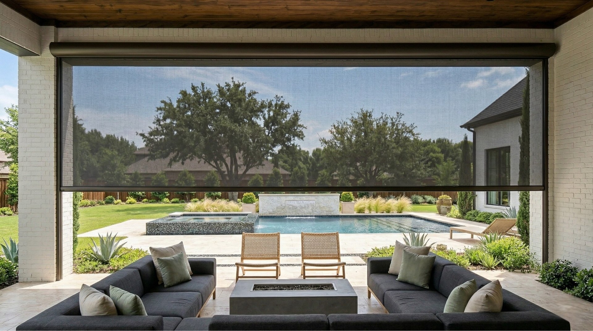 Motorized patio shade fully deployed with pool view in Southlake Texas